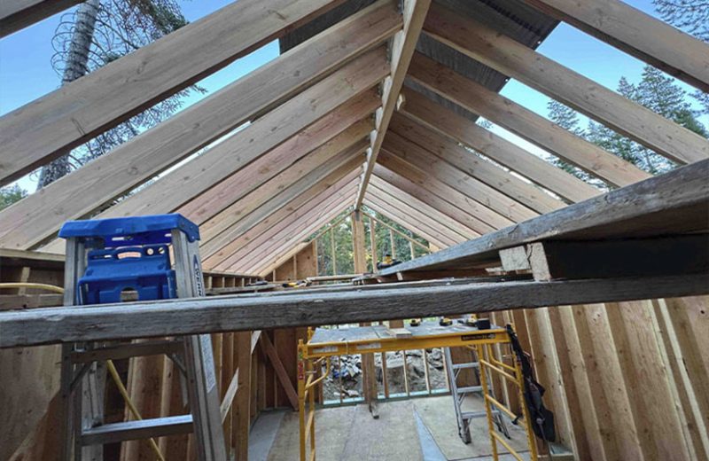 Custom home roof framing during construction by Upright Build Co.